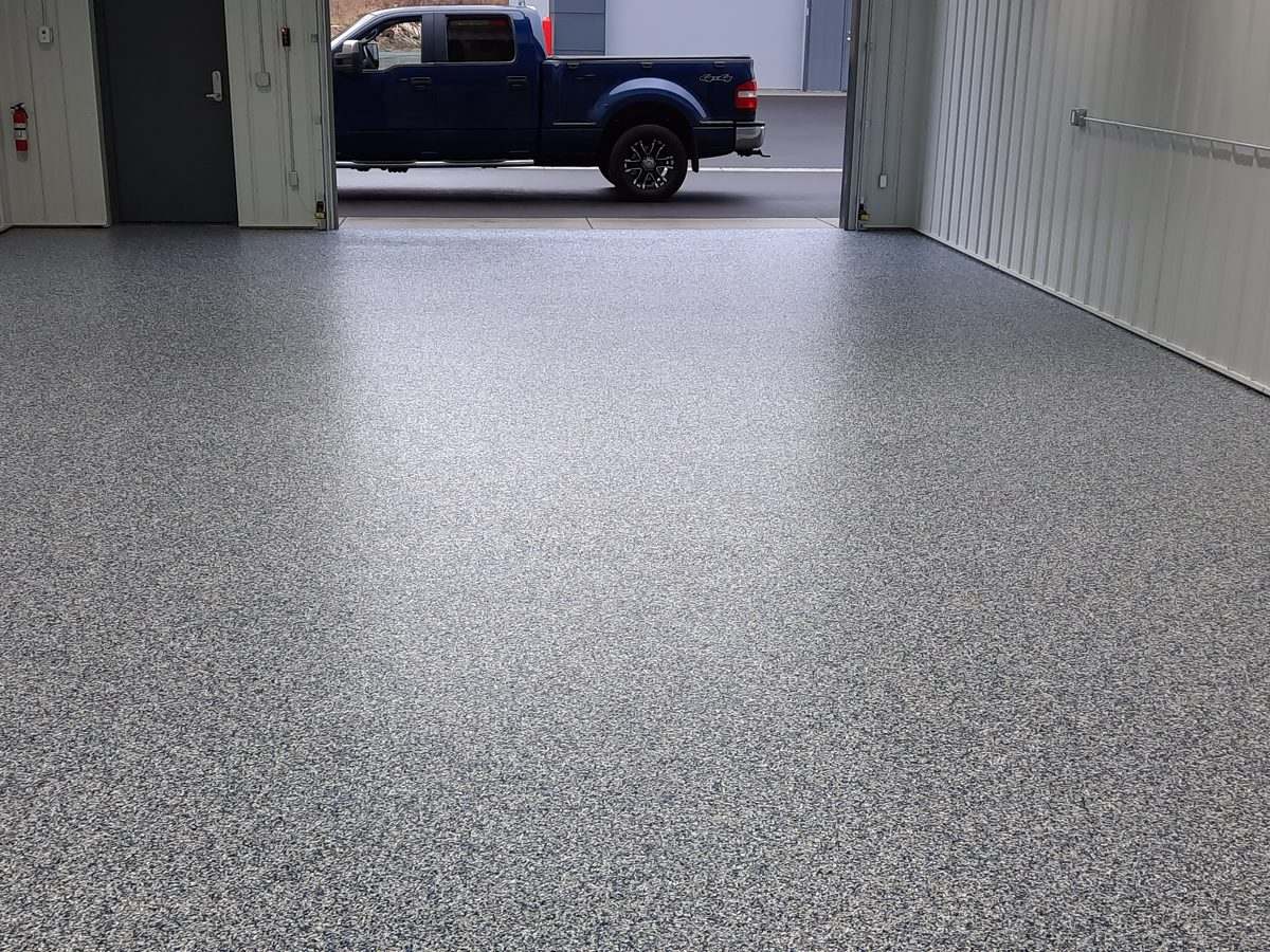 Commercial service bay floor coated with industrial polyurea